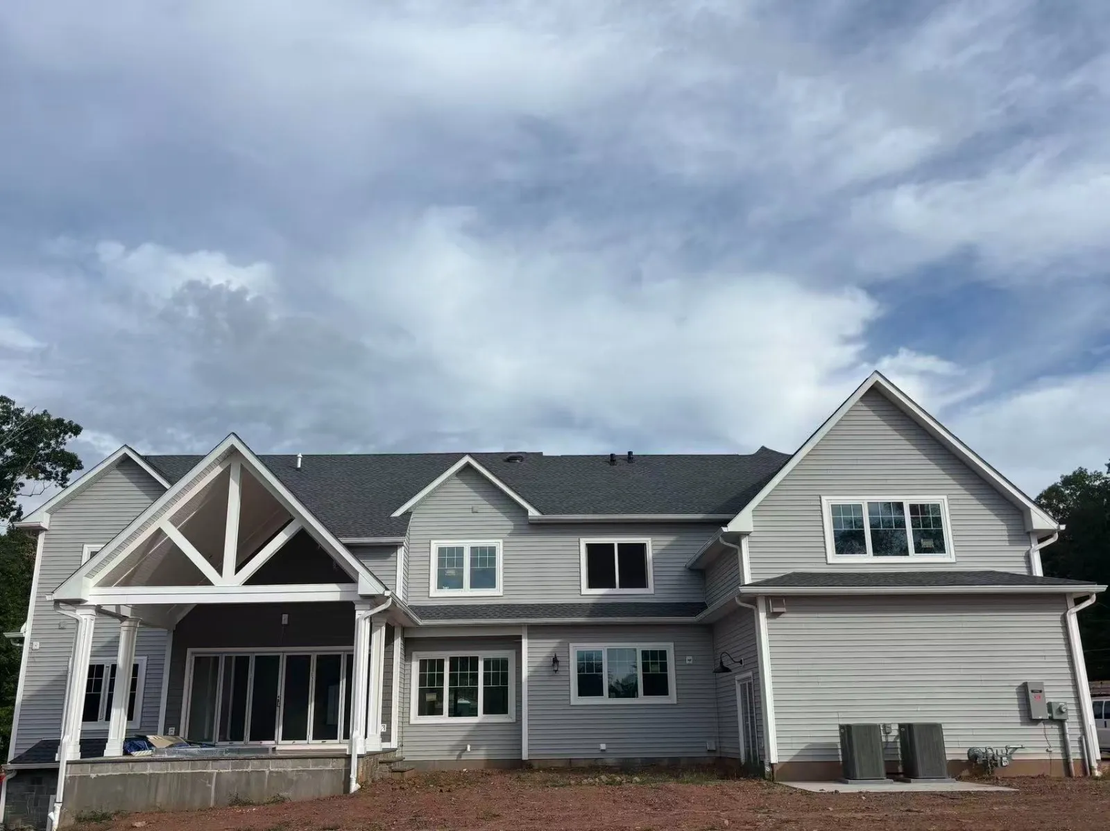 Contemporary home exterior detail showing large operable windows