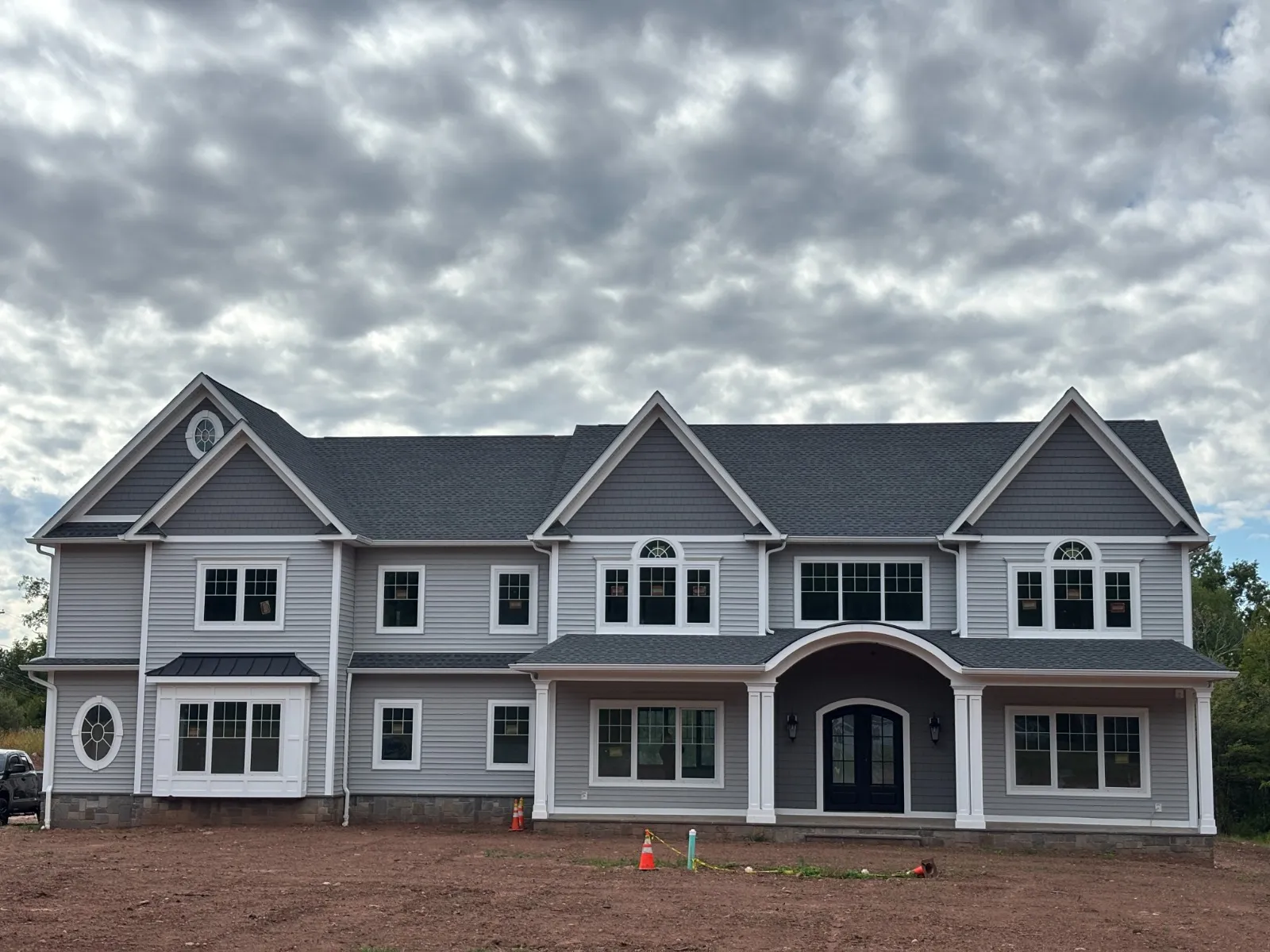 Contemporary home exterior with large black-framed windows