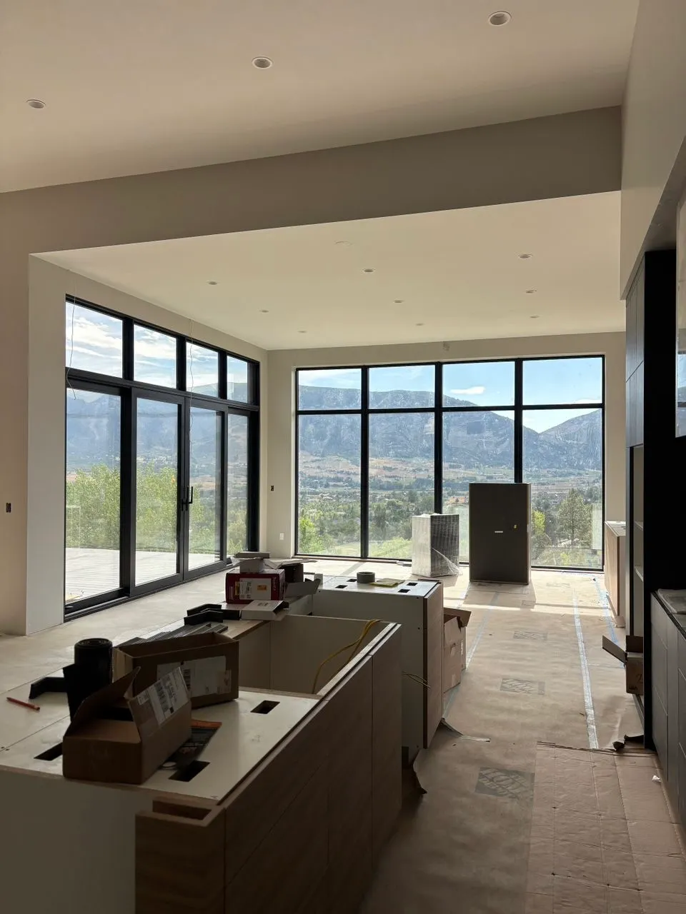 Interior of a custom home showing floor-to-ceiling made-to-order windows