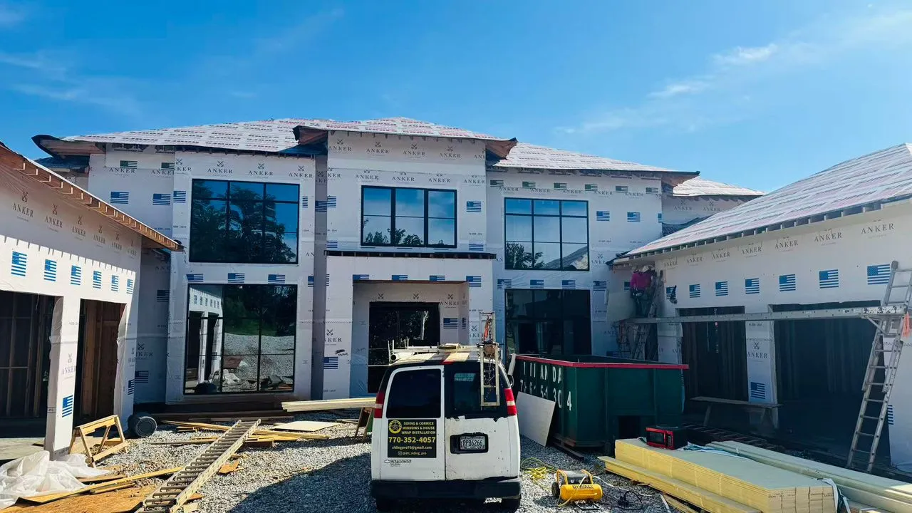 Home exterior featuring large glazed patio door openings